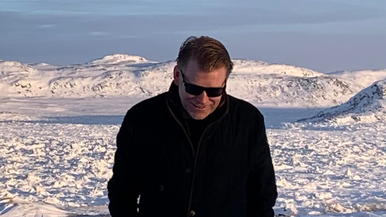 A picture of Patrick outside and walking toward the camera