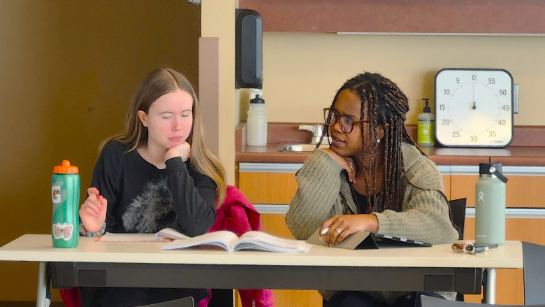 A youth works one-on-one with a United for Literacy tutor, building skills and confidence through personalized support.