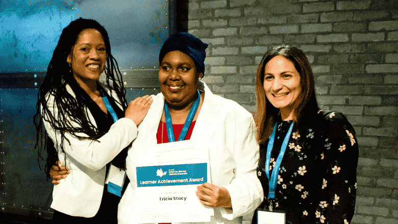 United for Literacy CEO Mélanie Valcin standing beside Tricia Sandy, a program participant and recipient of the 2025 Learner Achievement Award.