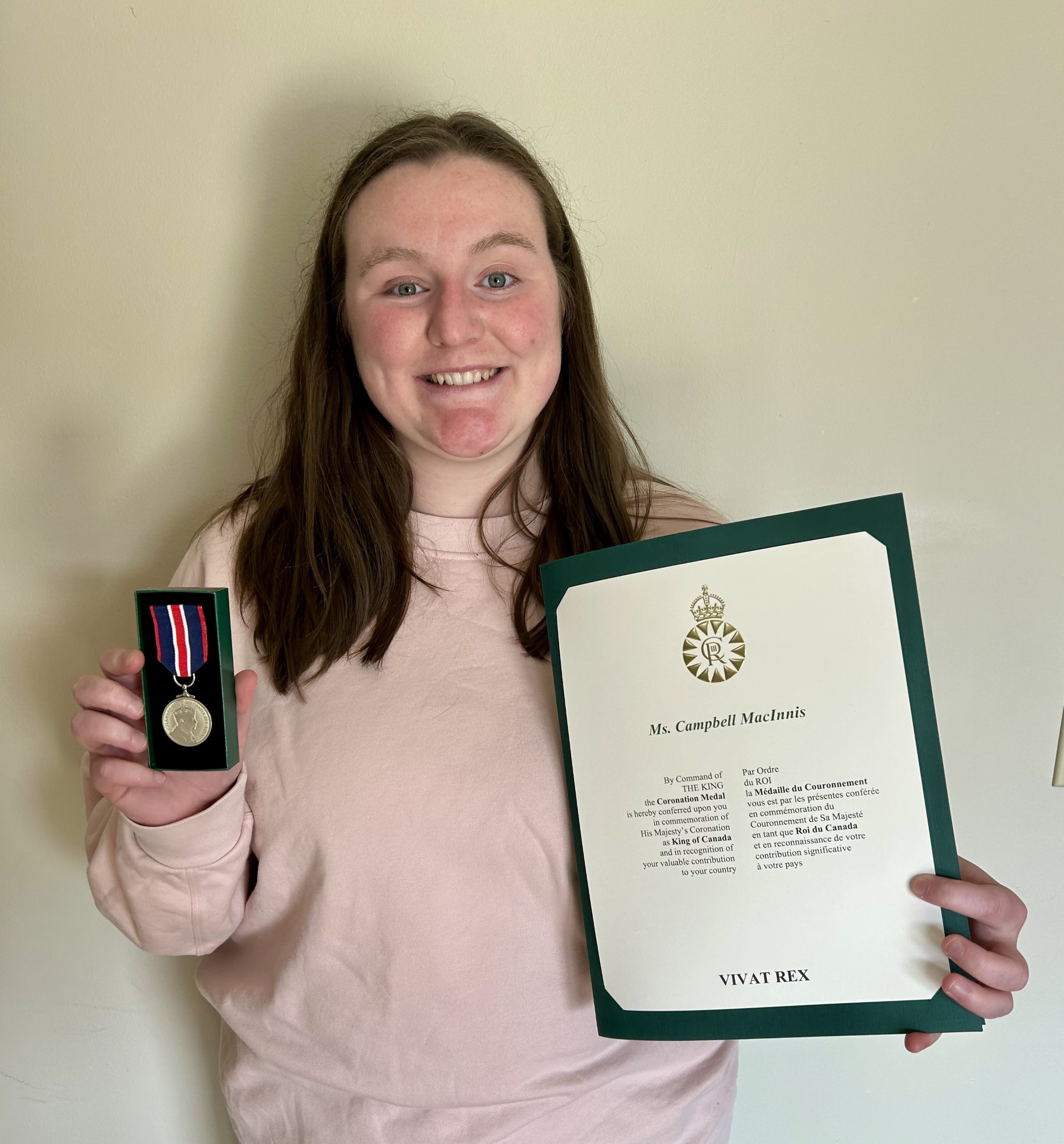 Campbell McInnis holding the Kind Charles III Coronation Medal.